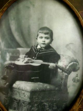 Antique PHOTO IN LEATHER FRAME - LITTLE BOY IN VICTORIAN CHAIR HOLDING GUITAR 2