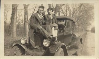 Man And Woman Sitting On Hood Of Old Antique Car Vintage Photograph