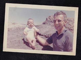Vintage Photograph Man Wearing Sunglasses Holding Baby Sitting On Rocks