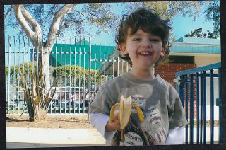 Vintage Photograph Adorable Little Boy Eating Banana At Park