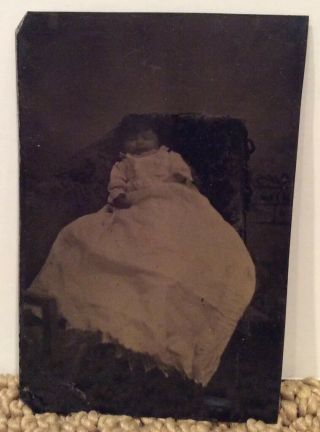 Tintype Of Baby Girl With Long Curly Hair Wearing Long White Dress Post Mortem