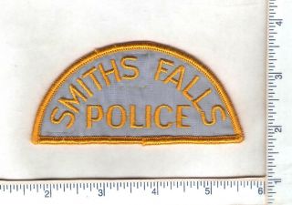 , 1 Early Smith Falls Police Department Patch.  (gold) (ontario)