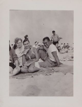 Old Vintage Photograph People Sitting On Blanket In Sand At The Beach