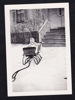 Antique Vintage Photograph Cute Baby Sitting In Snow Sled In Front Of House