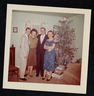 Old Vintage Photograph Two Couples Standing By Christmas Tree In Retro Room