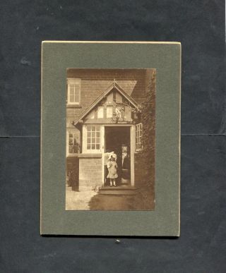 C1900 Mounted Photo Of A Small Girl In Doorway Of House.