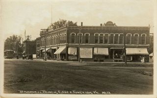 Essex Junction,  Vt Rppc Trolley Passing The Brownell Block C1915