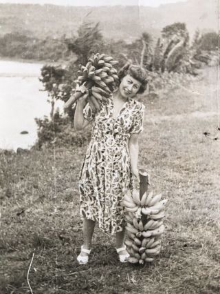 Vintage Photograph Of A Lady Holding Bunches Of Bananas