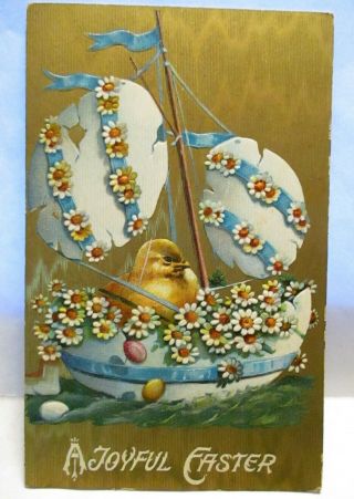 1910 Postcard Joyful Easter,  Baby Chick In Egg Boat With Daisies