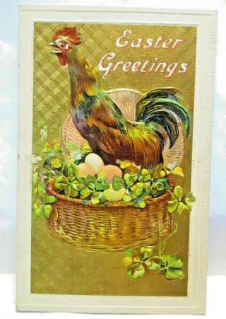 1910 Postcard Easter Greetings,  Rooster On Basket Of Colored Eggs & Shamrocks