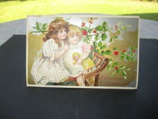 C.  1910 Christmas Card Postcard 2 Sisters In Chair Delray Detroit Postmark