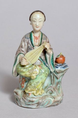 THREE ANTIQUE CHINESE POTTERY AND PORCELAIN FIGURES 2