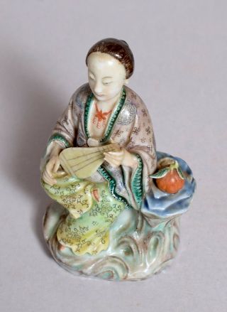 THREE ANTIQUE CHINESE POTTERY AND PORCELAIN FIGURES 3