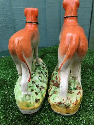 PAIR: 19thC STAFFORDSHIRE GREYHOUND DOGS WITH RABBITS TO BASES c1880s 7