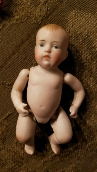 4.  25 Antique All Bisque German Baby Boy,  Marked 830.  2,  Face