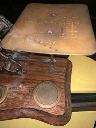 Antique Postal Scale with 4 weights.  Needs Dusting And Polishing.  Cool 4