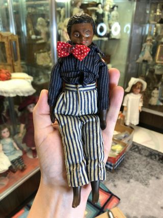Antique 8.  5 Inch Black Bisque Man Doll Molded Hair,  Elaborate Sculpting C.  1900