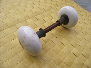 Vintage White Ceramic Door Knob Set With Spindle And Wear Showing Heavy Use