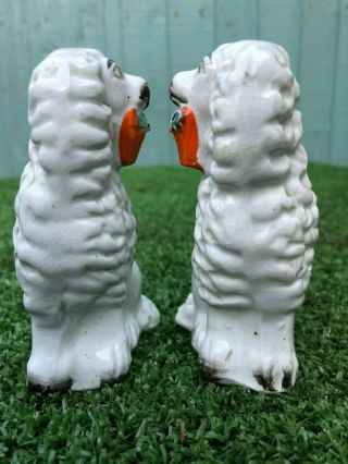 PAIR: 19thC STAFFORDSHIRE POODLE DOGS WITH BASKETS IN MOUTHS c1880s 7