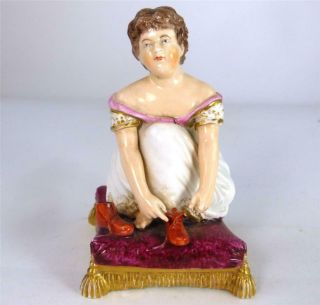 N948 C1800 - 1825 Antique Derby Porcelain Figure Of Seated Girl Tying Shoelace