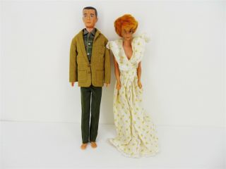 Two Vintage 1960s Barbie And Ken Dolls With Outfit