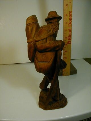 vintage carved wood figure man with back pack 5