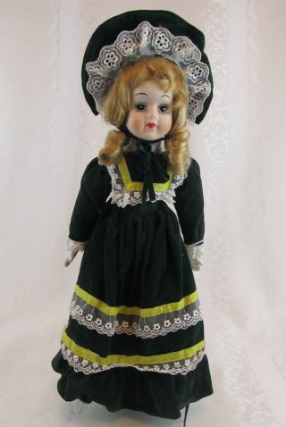 Porcelain Walda Doll Wearing Green Velvet Dress