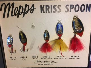 Vintage Mepps Lures In A Store Display Case