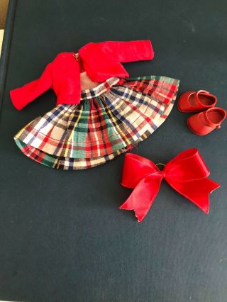A vintage Vogue Ginny Doll Dress with a skinny Vogue Tag from 1952 2