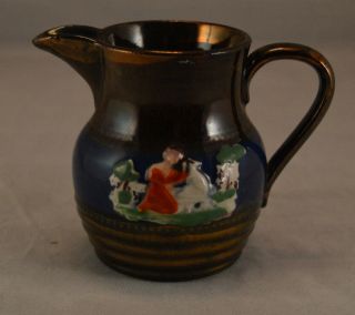 Antique Copper Luster Cream Pitcher With Hand Painted Raised Figures - Girl Dog