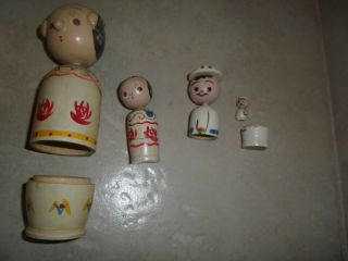 2 Wood Nesting Panama,  Woman 4 " W 2 " Doll,  Man 2.  5 W 3/4 Doll.  Hand Painted