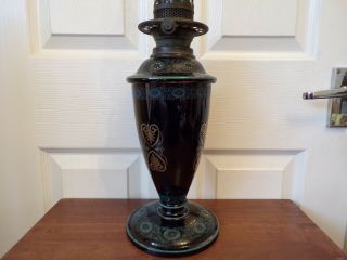 A Victorian black glazed pottery oil lamp drop in font order very ornate 4
