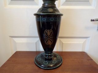 A Victorian black glazed pottery oil lamp drop in font order very ornate 5