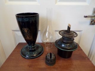 A Victorian black glazed pottery oil lamp drop in font order very ornate 7
