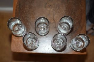 A FINE ANTIQUE SILVER RIMMED SHOT GLASSES 5