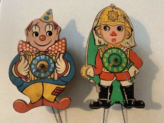 Pair Vintage Moving Eye Novelty Cuckoo Type Clock Clown & Soldier Weight Driven
