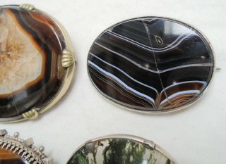 Three large antique sterling silver,  tiger eye & agate brooches,  1 (a/f) 2