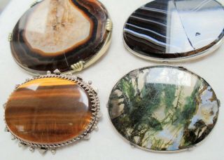 Three large antique sterling silver,  tiger eye & agate brooches,  1 (a/f) 3