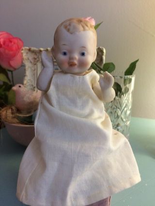 Antigue Porcelain Baby Doll.  Fully Jointed With Gown & Diaper.