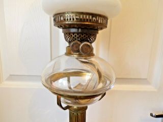 A stunning heavy Victorian brass column oil lamp glass drop in font twin burner 4
