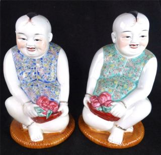 Pair Chinese Famille Rose Porcelain Figures Of Seated Children With Fruit