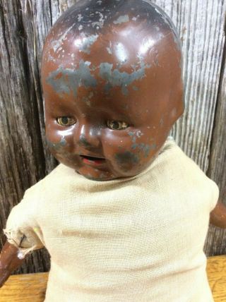Antique pressed metal doll African American stuffed body 2