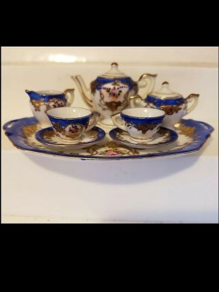 Miniature Porcelain Tea Set With Roses And Heavy Gold Accents