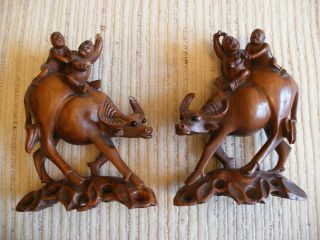 Pair (2) Of Chinese Hand Carved Wood Oxen Figurines Two Men Riding On Back Asian