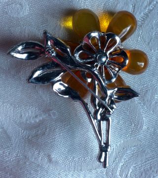 Vintage/antique flower brooch,  rhodium leaves w/stones,  large plastic 