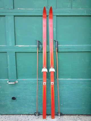 A Very Interesting Vintage Wooden 75 " Long Skis With Red Finish And Poles