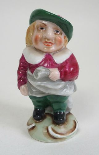 An Antique Continental Porcelain Figure Of A Man / Dwarf