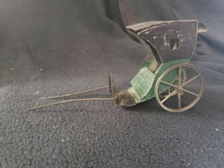 Antique Pressed Metal Tin Rickshaw Doll Toy