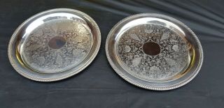 A Matching Vintage Silver Plated Serving Trays With Elegant Patterns.