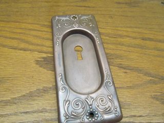Old Brass ? Bronze ? Pocket Door Backplate.  Door Plate.  Escutcheon.  Ornate